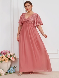 Detail of elegant pink V-neck evening gown featuring sequined bodice and flared sleeves