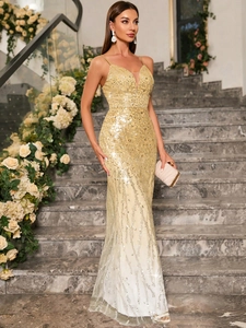 Detail of sequined champagne gold evening dress with V-neck and mermaid hemline