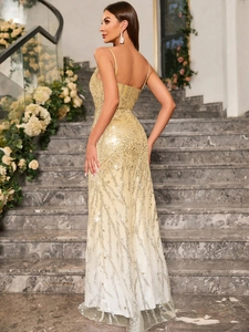 Detail of champagne gold sequin embroidery on a floor-length evening gown for parties