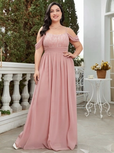 Elegant mauve chiffon maxi dress with lace bodice and back bow tie detail in a garden