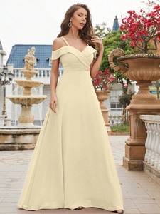 Detail of off-the-shoulder pleated neckline and spaghetti straps on beige chiffon dress