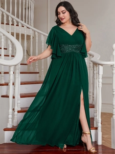 Detail of sequined waist and ruffled sleeves on dark green V-neck long evening dress