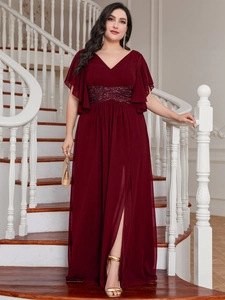 Detail view of burgundy evening dress featuring a deep V-neck and sequined waist details