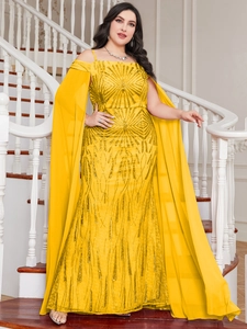 Detailed view of bright yellow sequins and sheer chiffon cape sleeves on a long dress