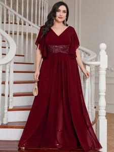 Close-up of sequin-embellished waist detail on a wine red V-neck chiffon maxi dress