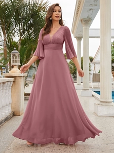Close-up of elegant dusty rose V-neck evening gown with pleated bodice and flared sleeves