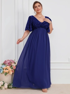 Detail of elegant plus size dark blue evening gown with sequined V-neck and chiffon skirt