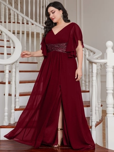 Detail of burgundy V-neck evening gown with sequin waist belt and high slit hemline