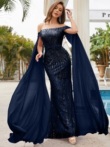 Close-up of sparkling sequin patterns and elegant cape sleeves on a navy evening dress