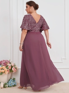 Detail view of purple evening gown featuring elegant V-back design and sequin mesh bodice