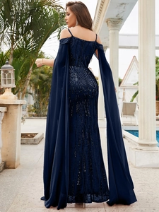 Detail of navy blue sequin embroidery on evening dress with fringed cape sleeves