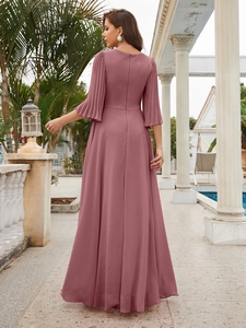 Detailed back view of a long dusty rose chiffon dress featuring pleated bell sleeves