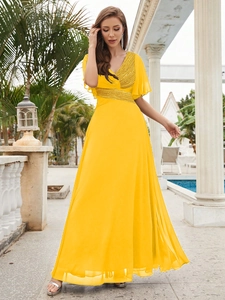 Elegant yellow chiffon evening gown with deep V-neck, gold sequins and ruffled sleeves