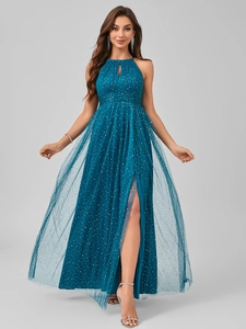 Close-up of halter neck dress with mesh overlay, glitter spots, and a high leg slit detail