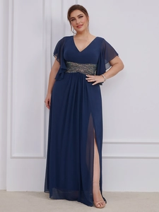 Detail of elegant V-neck dark blue gown featuring sequin belt and high slit chiffon skirt