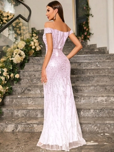 Detail view of the elegant lavender sequin fabric on an off-shoulder mermaid evening gown