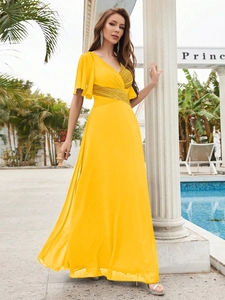 Elegant yellow V-neck maxi dress with sequin details and ruffle sleeves for evening wear