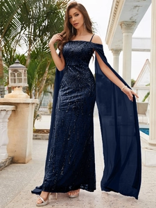 Macro detail of navy blue sequins and flowing chiffon cape sleeves on evening gown