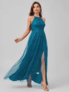 Detail showing the sheer mesh fabric with shimmering sequins on the elegant evening gown