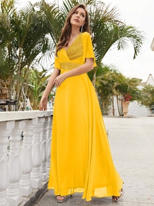 Elegant yellow V-neck maxi dress with sequin bodice and flowing chiffon skirt