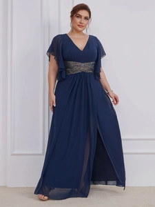 Detail view of the V-neck navy blue evening gown showing sequin waist and side slit