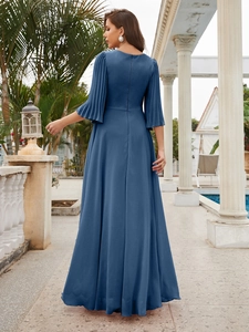 Detail of elegant navy blue evening gown back with pleated bell sleeves and hidden zipper
