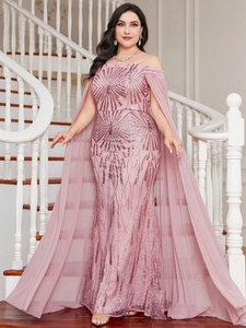 Detailed close-up of pink sequin evening gown with a cape sleeve and mermaid hem