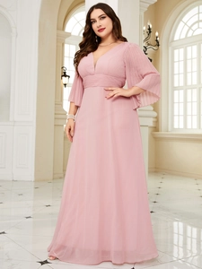 Detailed view of light pink maxi dress featuring V-neckline and pleated bell sleeves
