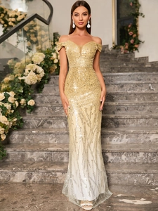 Close-up of golden sequins and geometric texture on off-shoulder mermaid evening gown