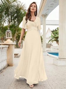 Close-up of sparkling sequin waist detail and ruffled sleeves on this V-neck evening gown