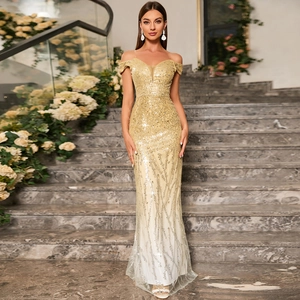 Detail of off-the-shoulder gold sequin evening gown with sheer V-neck and mermaid tail
