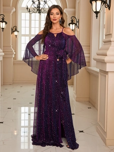 Detail of dark purple sequin evening gown showing oversized waist bow and glittery texture