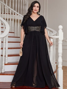 Detail view of V-neck evening gown with gold waist sequins and tiered ruffle sleeves
