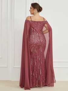 Close-up of elegant sequin patterns and chiffon cape on burgundy evening gown