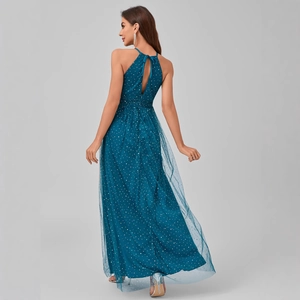 Elegant halter neck evening dress with sequins and mesh overlay in dark teal blue