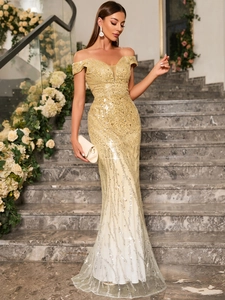 Detailed view of champagne gold sequins and off-shoulder neckline on evening gown