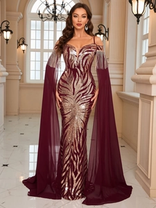 Detail of the sequins pattern on a burgundy evening gown with sheer chiffon sleeves