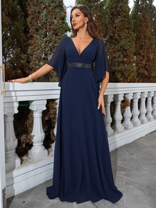 Detail of elegant V-neck navy blue dress with sheer bell sleeves and beaded waist