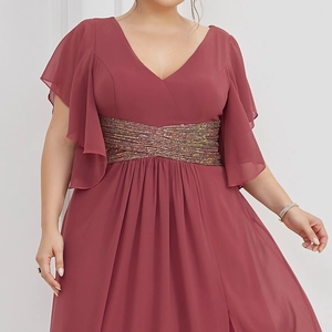 Detail of plus size V-neck dress featuring ruffled sleeves and sequined waist belt