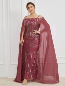 Close-up of sparkling sequin embroidery and sheer tulle shawl on a burgundy evening gown