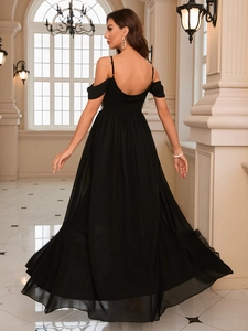 Detail of the elegant open-back design on a black floor-length sequin evening gown