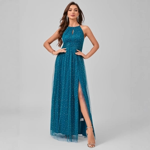 Elegant peacock blue halter neck evening gown with glitter dots and a high side slit mesh skirt