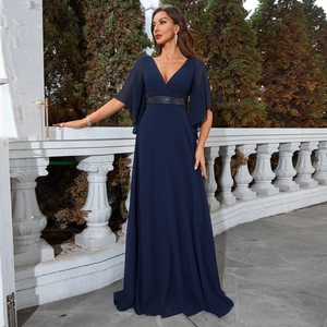 Detailed view of elegant V-neck dark blue evening dress with sequined belt and chiffon sleeves