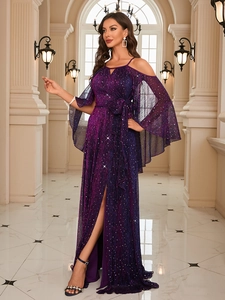 Close-up of shiny sequin fabric on deep purple evening gown with starry sky effect