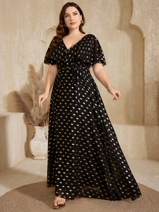 Detail of V-neck maxi dress with golden polka dots and elegant ruffled short sleeves