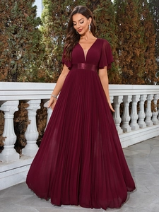 Detail of elegant V-neck wine red pleated chiffon gown with flutter sleeves and satin belt