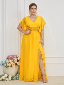 Detailed view of yellow maxi dress with sequins waist and high slit design
