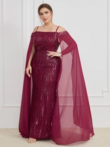 Close-up of sparkling burgundy sequins on an elegant off-shoulder evening gown
