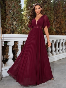 Detail of elegant wine red pleated chiffon evening dress with V-neck and satin waistband