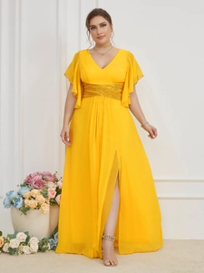 Detail view of yellow V-neck evening dress with sequined waist belt and flutter sleeves